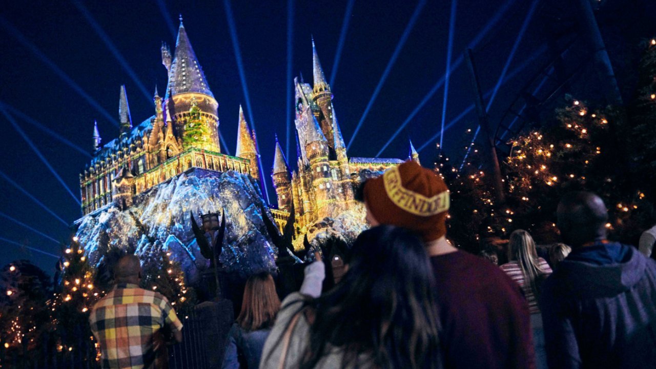 Crowd watches Disney castle light show