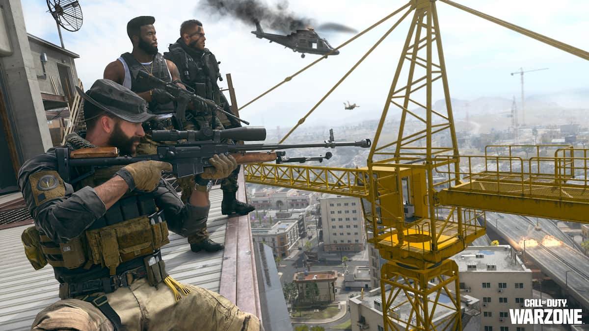 Soldiers overlooking city from rooftop