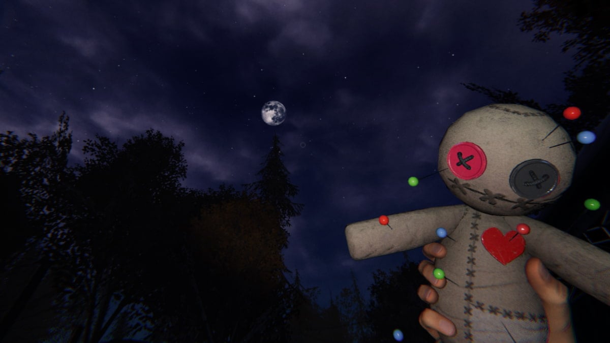 Voodoo doll silhouetted against moon