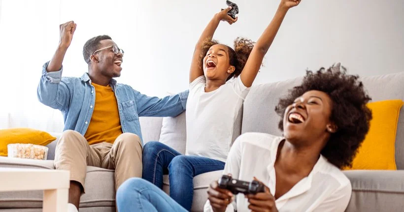 Family plays console games together