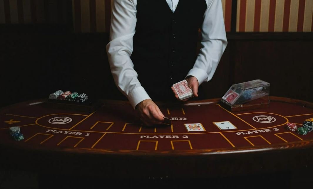 Casino dealer shuffling playing cards