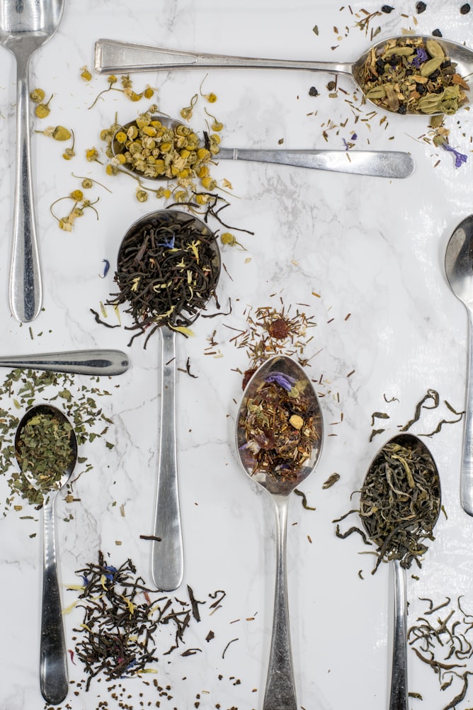 Various tea bags on white surface