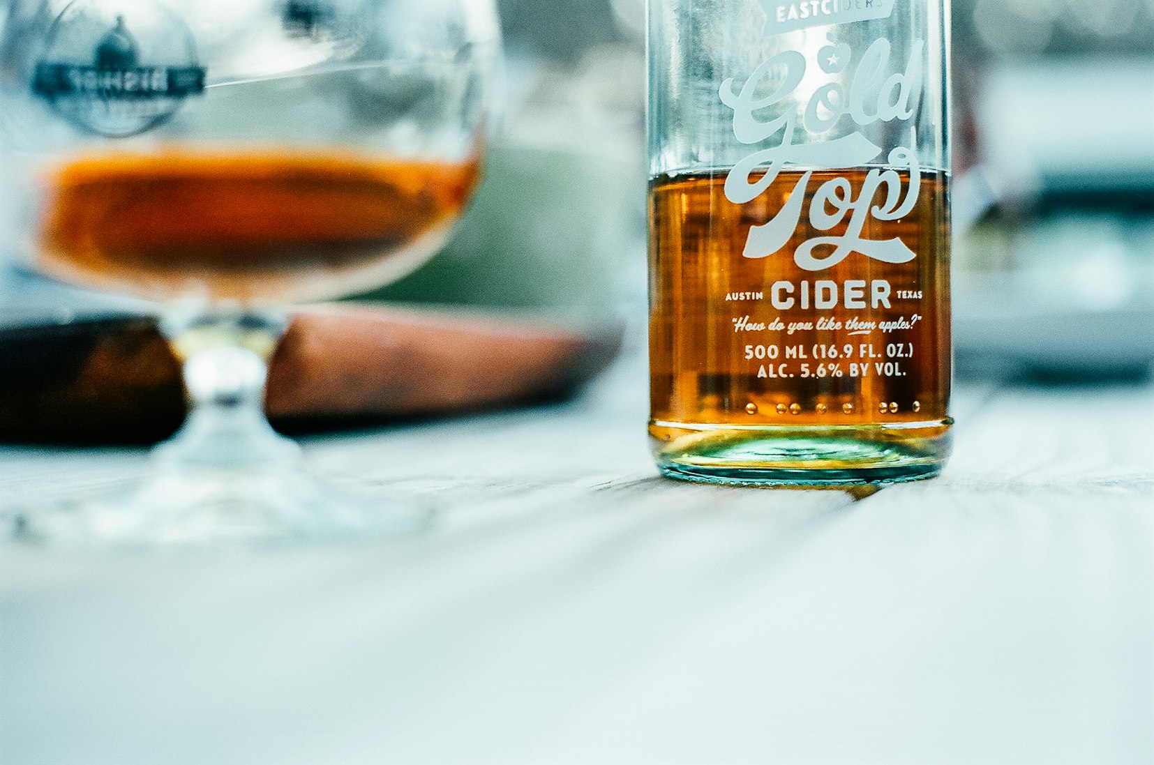 Glass bottle of amber cider