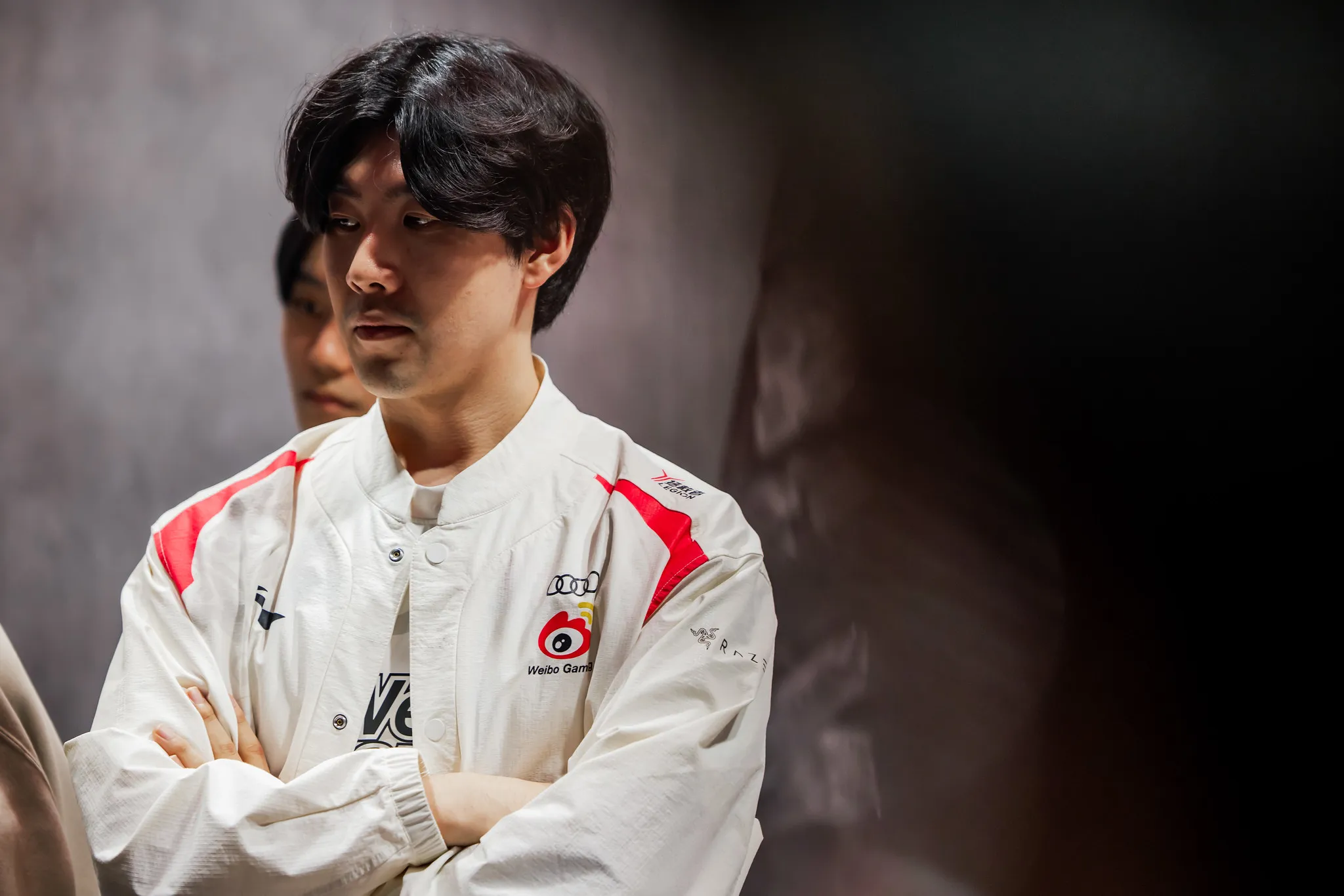 TheShy wearing white LPL jacket