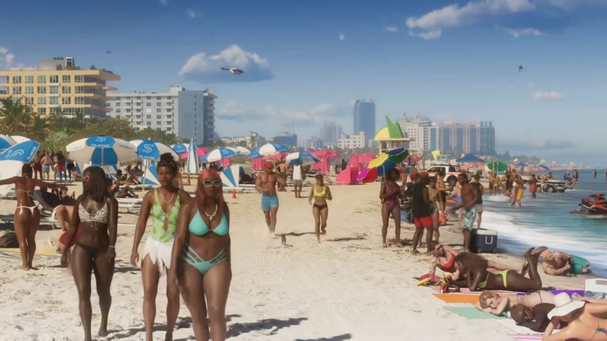 Women walking on sunny beach