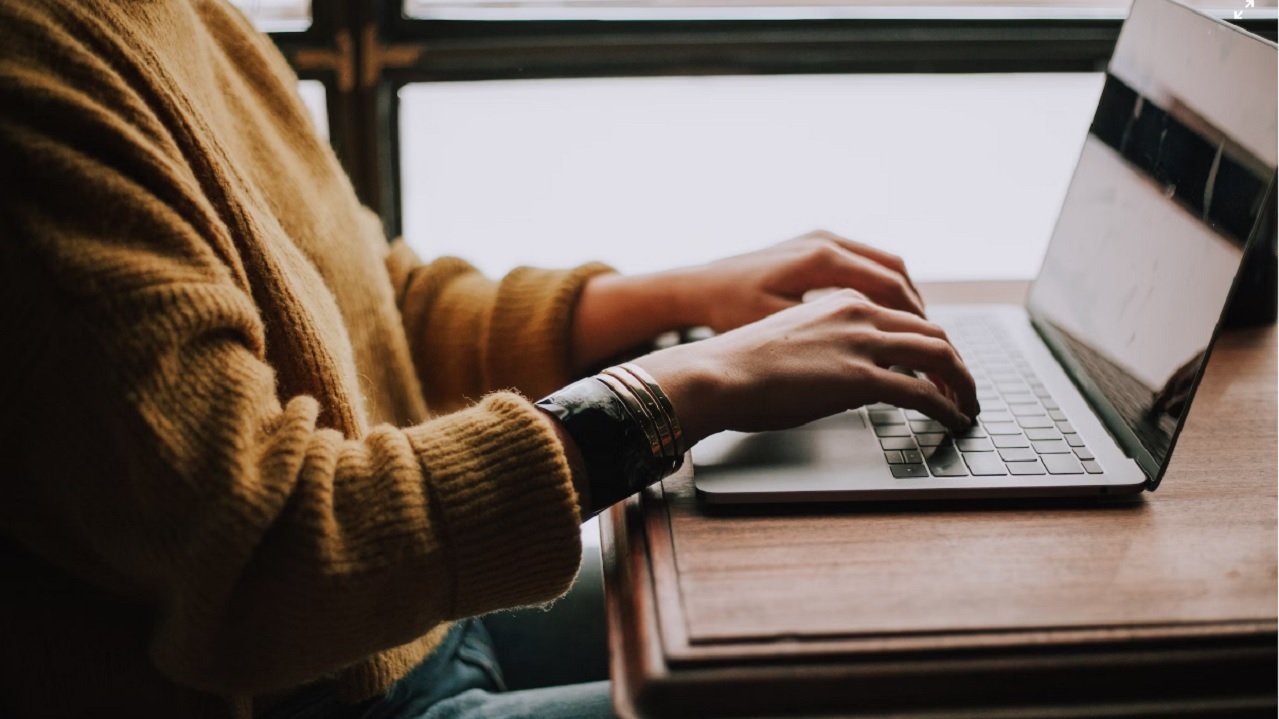 Woman typing on laptop