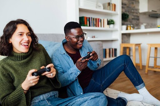 Couple gaming together on couch