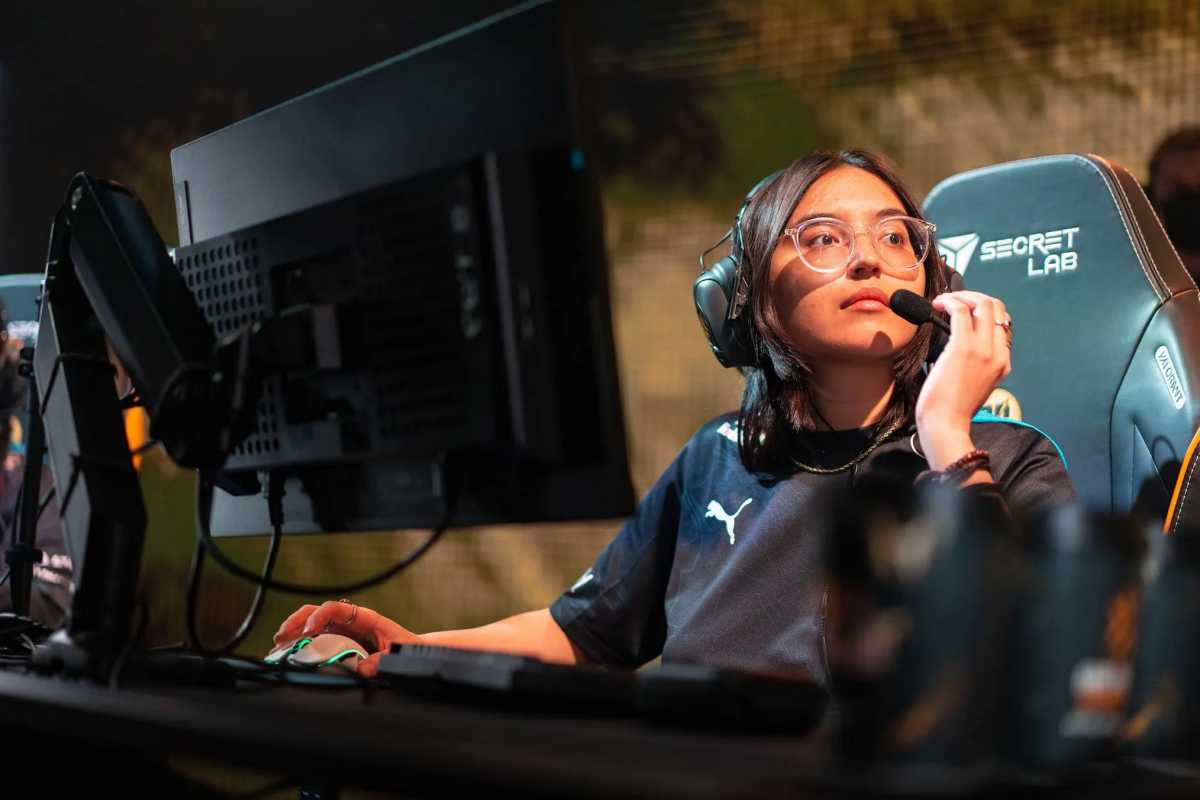 Woman wearing headset playing competitive game