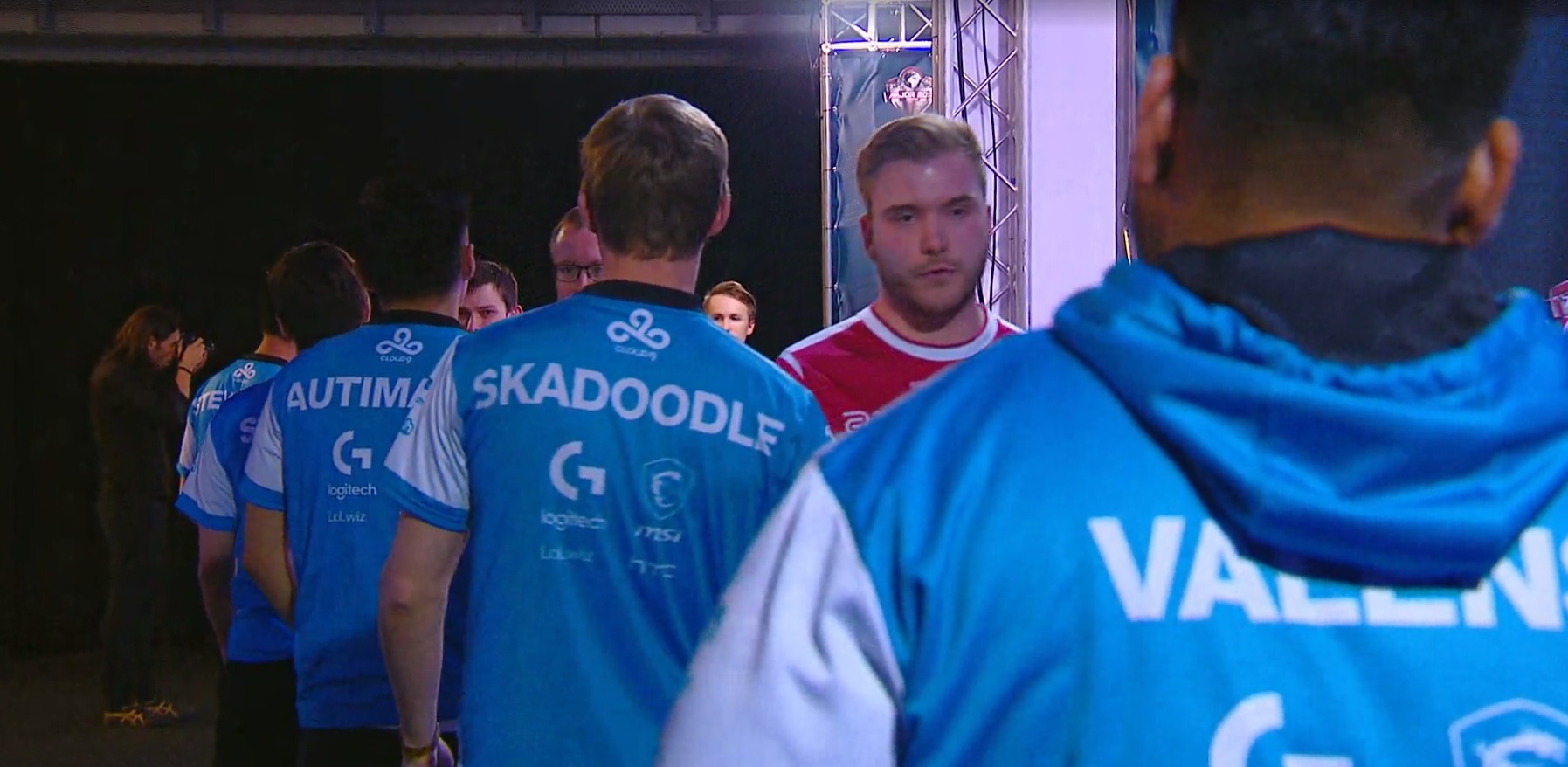 Cloud9 players walk through arena hallway